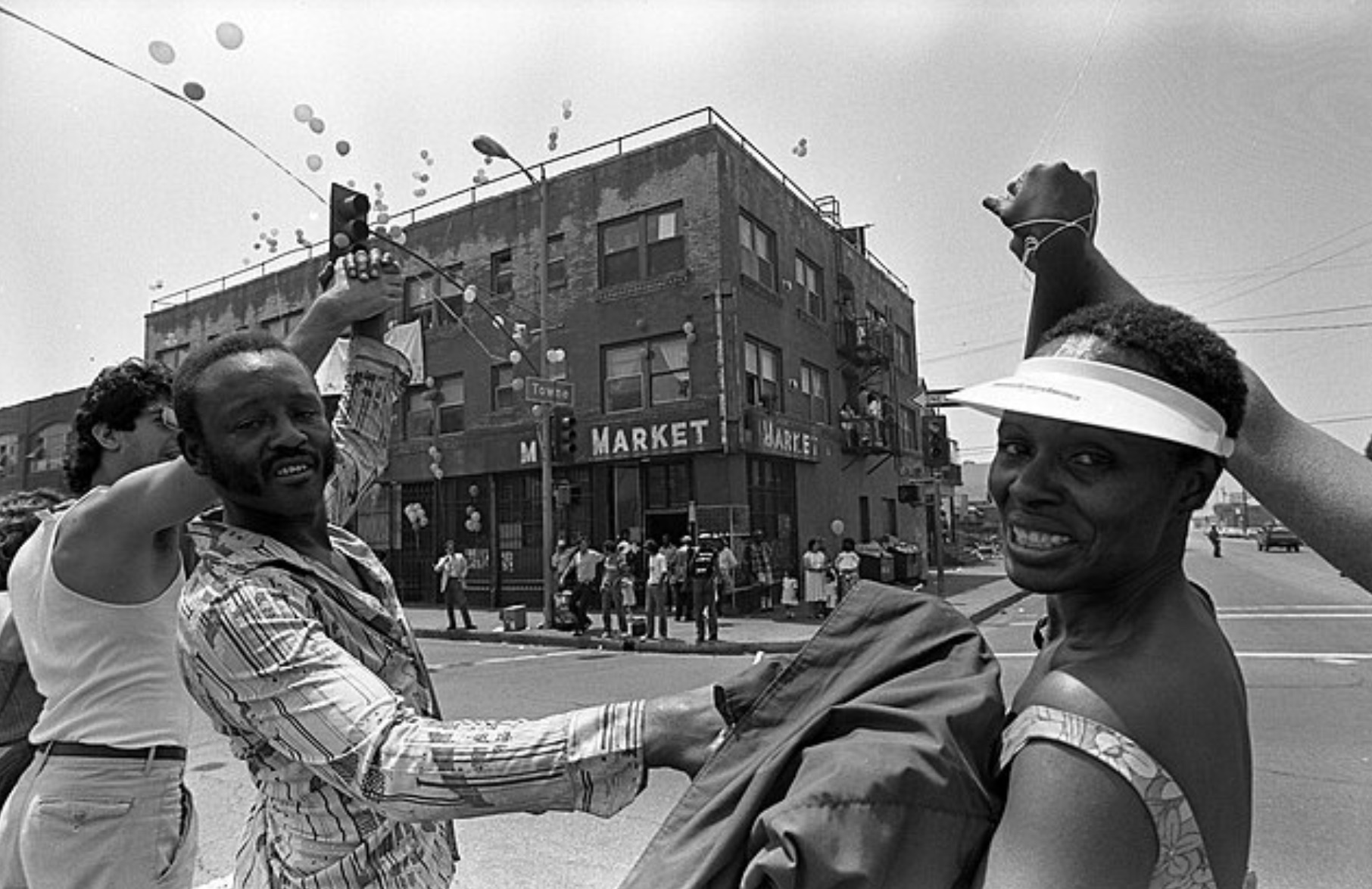 Singer Maria Williams holding the hand of Daniel Rias, a homeless man, in East Los Angeles, as part of Hands Across America.